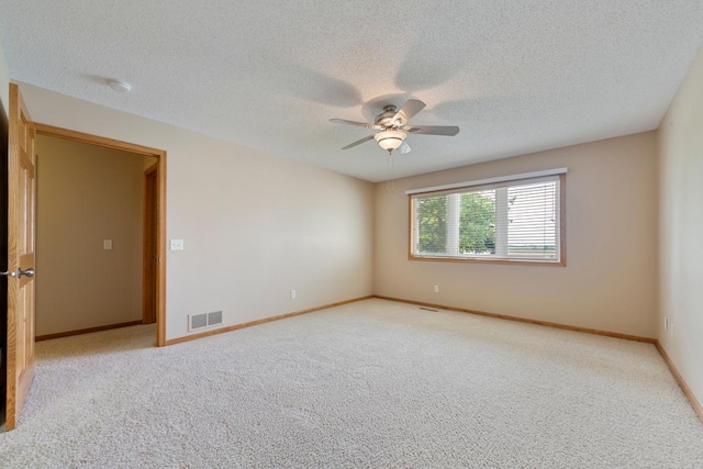 2475 Mossy Creek Dr NE, Owatonna, MN 55060 - carpeted spare room with a ceiling fan and a textured ceiling