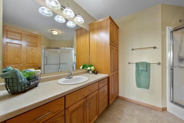 2475 Mossy Creek Dr NE, Owatonna, MN 55060 - bathroom with a stall shower and vanity