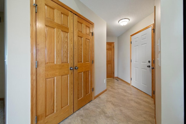 2475 Mossy Creek Dr NE, Owatonna, MN 55060 - corridor with baseboards and a textured ceiling