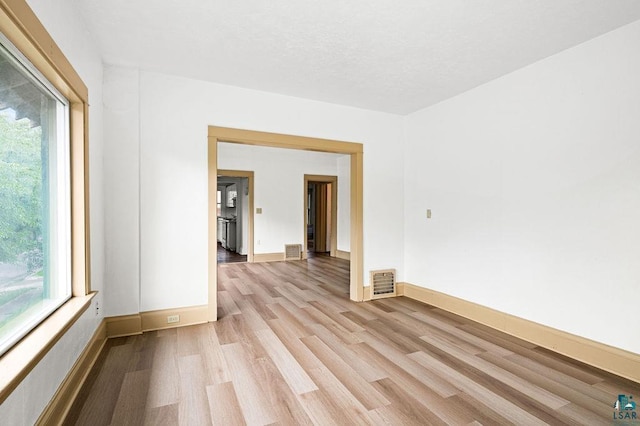 1006 87th Ave W Upper Unit, Upper Unit, Duluth, MN 55808 - spare room featuring light wood-style flooring and baseboards