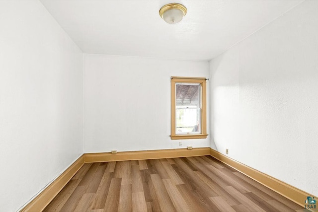 1006 87th Ave W Upper Unit, Upper Unit, Duluth, MN 55808 - spare room with wood finished floors and baseboards