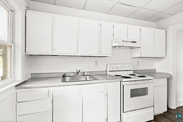 1006 87th Ave W Upper Unit, Upper Unit, Duluth, MN 55808 - kitchen with white range with electric stovetop, under cabinet range hood, a sink, a drop ceiling, and white cabinetry