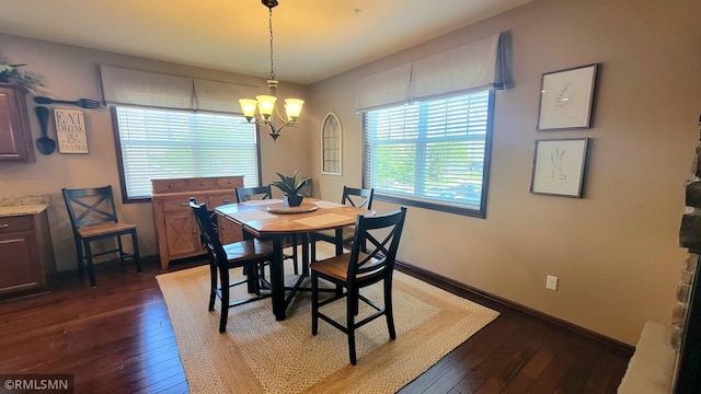 9695 Independence Cir Unit 4, Chanhassen, MN 55317 - dining space featuring dark wood finished floors, a chandelier, and baseboards