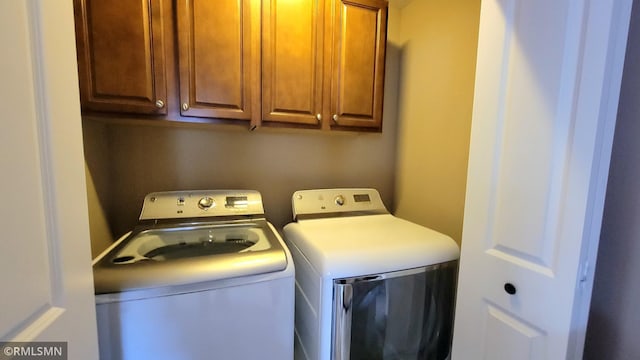 9695 Independence Cir Unit 4, Chanhassen, MN 55317 - laundry area featuring washer and dryer and cabinet space