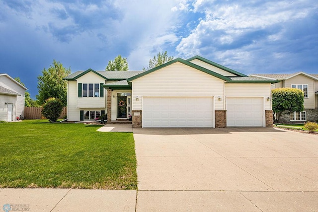1119 6th Ave W, West Fargo, ND 58078 - tri-level home featuring an attached garage and concrete driveway