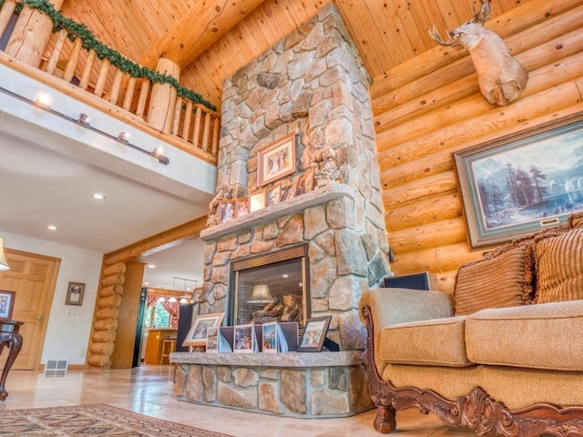 10719 Lumberjack Rd NW, Alaska Twp, MN 56667 - living area with log walls, recessed lighting, wooden ceiling, a stone fireplace, and a high ceiling