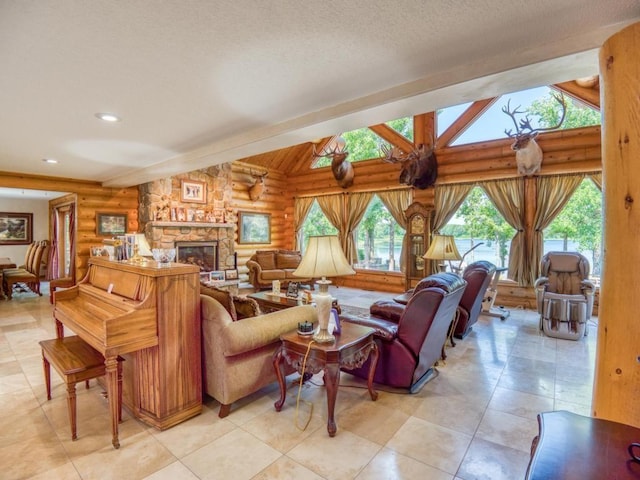 10719 Lumberjack Rd NW, Alaska Twp, MN 56667 - living room with log walls, lofted ceiling, a stone fireplace, and recessed lighting
