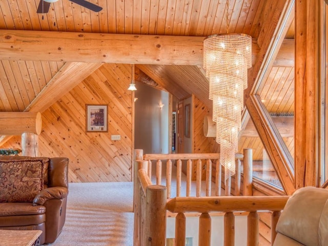 10719 Lumberjack Rd NW, Alaska Twp, MN 56667 - staircase with wooden ceiling, wooden walls, and a ceiling fan