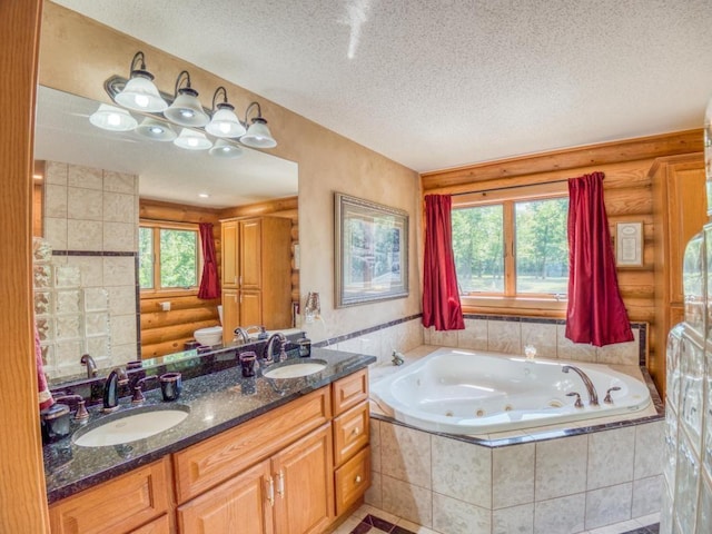 10719 Lumberjack Rd NW, Alaska Twp, MN 56667 - bathroom featuring log walls, a textured ceiling, a tub with jets, and double vanity