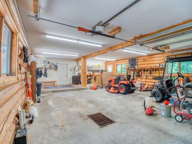 10719 Lumberjack Rd NW, Alaska Twp, MN 56667 - garage with a garage door opener and a workshop area