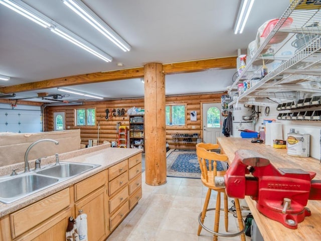 10719 Lumberjack Rd NW, Alaska Twp, MN 56667 - kitchen with rustic walls, a sink, and light countertops