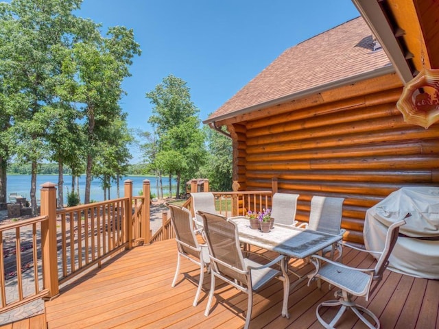10719 Lumberjack Rd NW, Alaska Twp, MN 56667 - deck featuring outdoor dining area and a water view