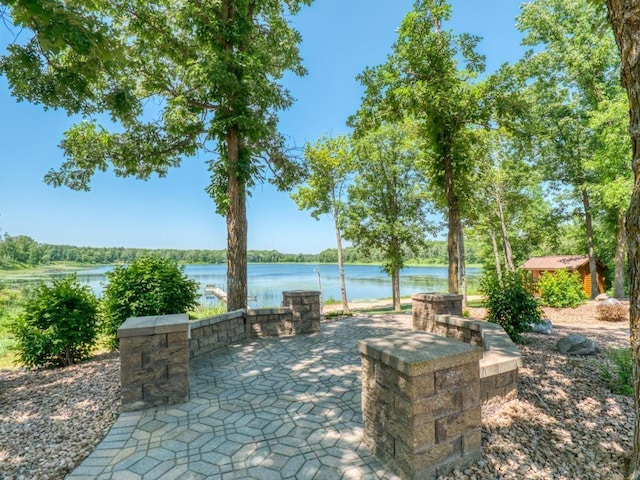 10719 Lumberjack Rd NW, Alaska Twp, MN 56667 - view of patio featuring a water view