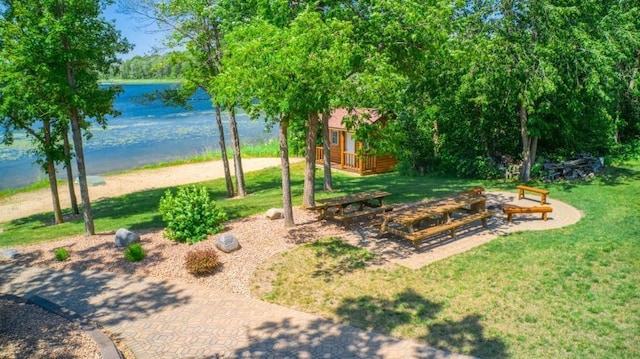 10719 Lumberjack Rd NW, Alaska Twp, MN 56667 - view of property's community with a lawn and a deck with water view