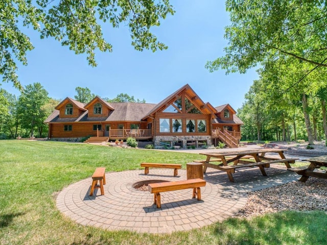 10719 Lumberjack Rd NW, Alaska Twp, MN 56667 - view of community featuring a fire pit, a yard, and a patio area