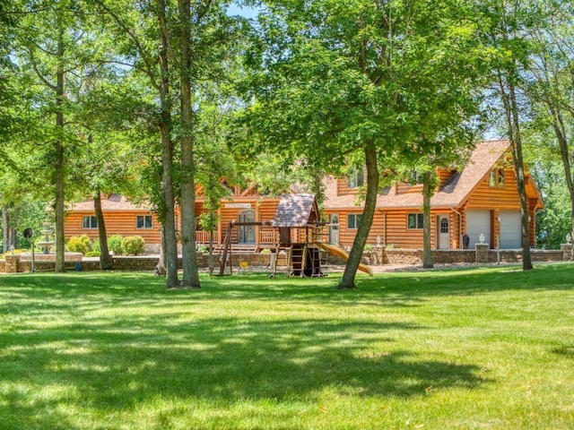 10719 Lumberjack Rd NW, Alaska Twp, MN 56667 - back of house with a playground and a lawn