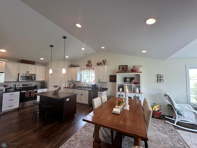 879 Longview Dr, Detroit Lakes, MN 56501 - dining room with vaulted ceiling, dark wood finished floors, and recessed lighting