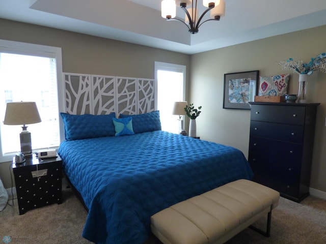879 Longview Dr, Detroit Lakes, MN 56501 - carpeted bedroom with a chandelier and multiple windows