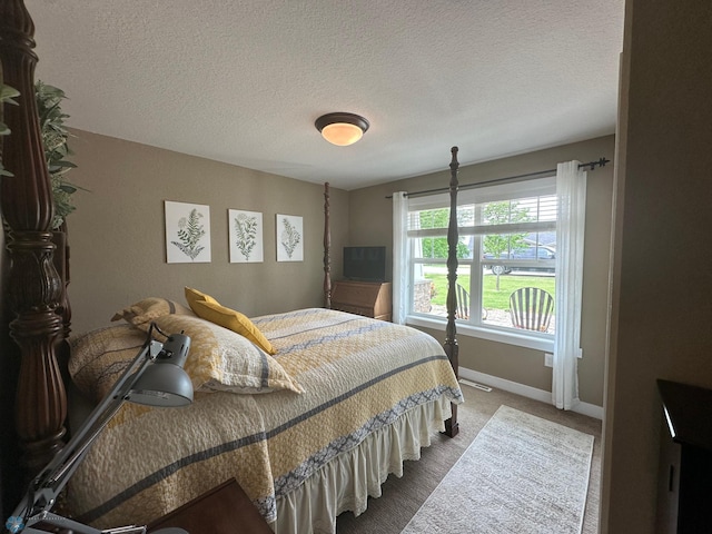879 Longview Dr, Detroit Lakes, MN 56501 - bedroom with baseboards, a textured ceiling, and carpet floors