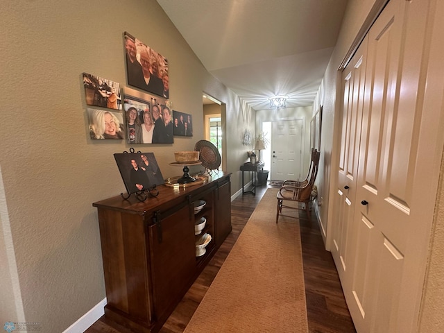 879 Longview Dr, Detroit Lakes, MN 56501 - corridor with dark wood-type flooring, baseboards, vaulted ceiling, and a textured wall