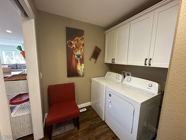 879 Longview Dr, Detroit Lakes, MN 56501 - washroom featuring cabinet space, dark wood-type flooring, washer and dryer, and baseboards