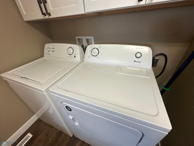 879 Longview Dr, Detroit Lakes, MN 56501 - laundry room featuring washer and clothes dryer, cabinet space, and dark wood-type flooring