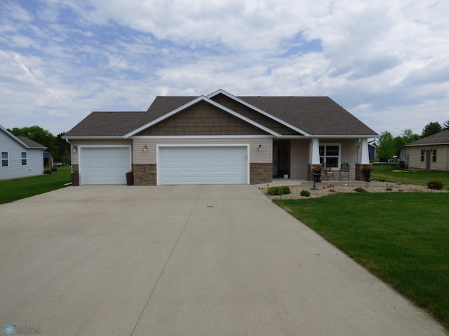 879 Longview Dr, Detroit Lakes, MN 56501 - craftsman-style house featuring a garage, a front lawn, concrete driveway, and stone siding