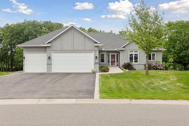 9536 Windflower Pl, Champlin, MN 55316 - single story home with asphalt driveway, an attached garage, a front lawn, and roof with shingles