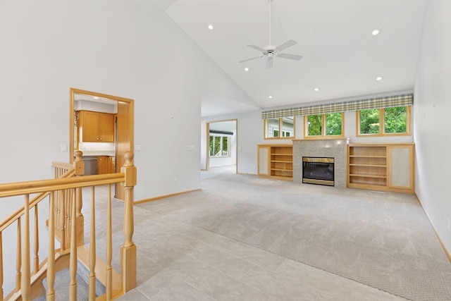 9536 Windflower Pl, Champlin, MN 55316 - unfurnished living room with light carpet, high vaulted ceiling, healthy amount of natural light, baseboards, and recessed lighting