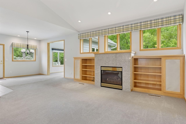9536 Windflower Pl, Champlin, MN 55316 - unfurnished living room featuring carpet floors, baseboards, recessed lighting, a chandelier, and a tile fireplace