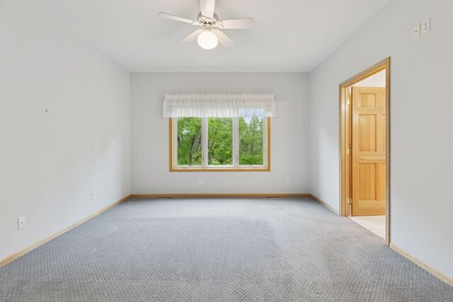 9536 Windflower Pl, Champlin, MN 55316 - carpeted empty room featuring a ceiling fan and baseboards