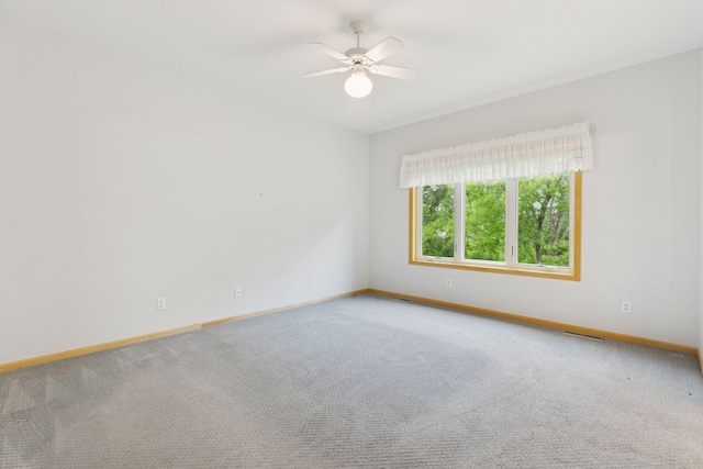9536 Windflower Pl, Champlin, MN 55316 - unfurnished room featuring baseboards, carpet, and ceiling fan
