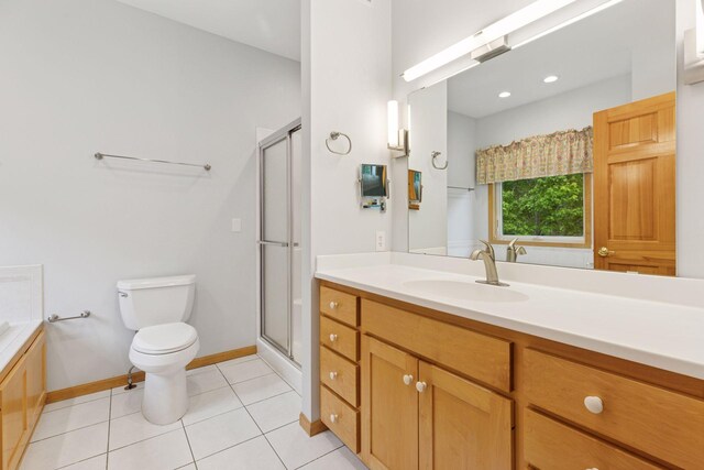 9536 Windflower Pl, Champlin, MN 55316 - full bath featuring toilet, a shower stall, tile patterned flooring, vanity, and baseboards