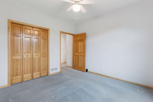 9536 Windflower Pl, Champlin, MN 55316 - unfurnished bedroom featuring light carpet, baseboards, ceiling fan, and a closet