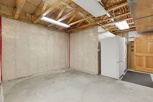 9536 Windflower Pl, Champlin, MN 55316 - below grade area featuring freestanding refrigerator