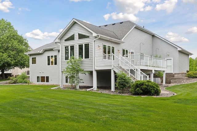 9536 Windflower Pl, Champlin, MN 55316 - rear view of property featuring a wooden deck, a lawn, stairs, and a shingled roof