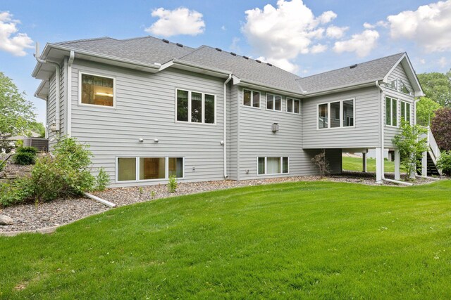 9536 Windflower Pl, Champlin, MN 55316 - back of house featuring a lawn and roof with shingles