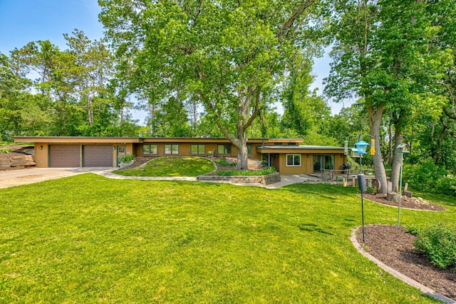 1970 Saint Croix Trl N, West Lakeland Twp, MN 55082 - view of front of house featuring a front yard, an attached garage, concrete driveway, and view of scattered trees