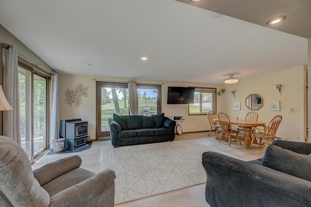 1970 Saint Croix Trl N, West Lakeland Twp, MN 55082 - living room with a wood stove, healthy amount of natural light, light wood-style floors, and recessed lighting