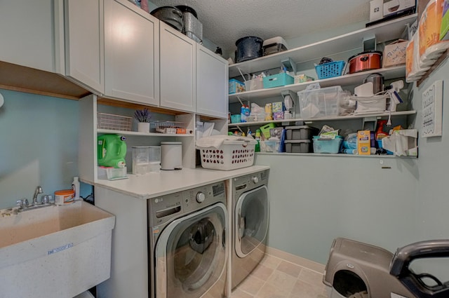 1970 Saint Croix Trl N, West Lakeland Twp, MN 55082 - washroom with cabinet space, washing machine and dryer, and a textured ceiling