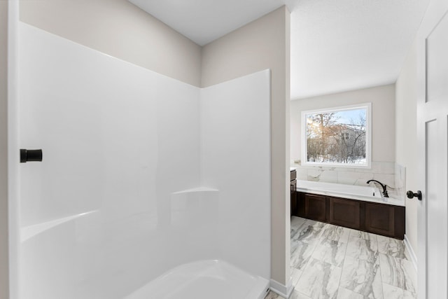 1700 Misty Cir, Buffalo, MN 55313 - bathroom featuring marble look tiles and a garden tub
