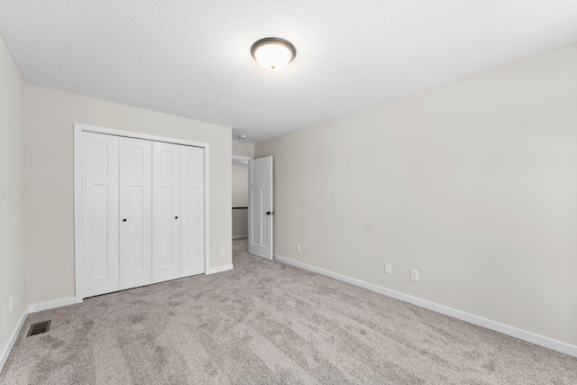 1700 Misty Cir, Buffalo, MN 55313 - unfurnished bedroom featuring carpet flooring, a closet, and baseboards