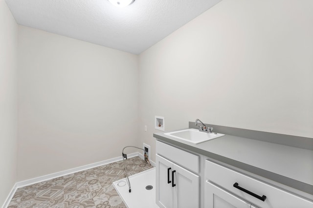 1700 Misty Cir, Buffalo, MN 55313 - washroom featuring washer hookup, cabinet space, baseboards, a textured ceiling, and light floors