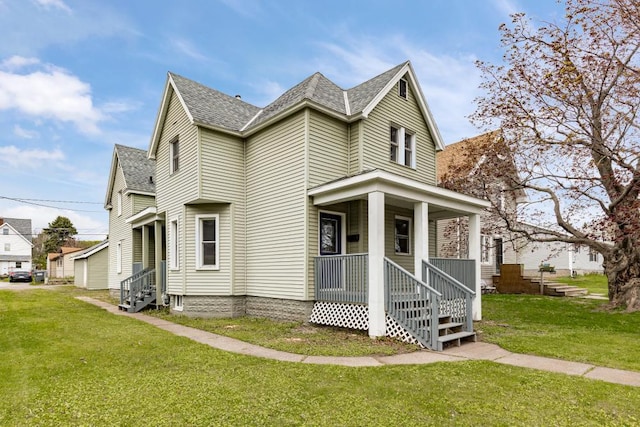 319 60th Ave W, Duluth, MN 55807 - view of front of home featuring entry steps, roof with shingles, a front yard, and covered porch