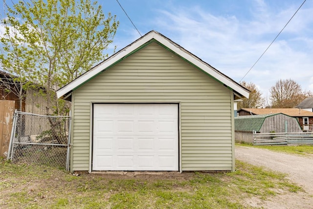 319 60th Ave W, Duluth, MN 55807 - detached garage with dirt driveway and a gate