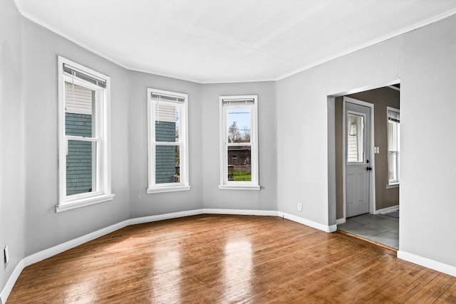 319 60th Ave W, Duluth, MN 55807 - spare room with wood finished floors, crown molding, and baseboards