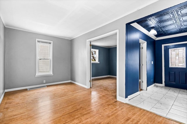 319 60th Ave W, Duluth, MN 55807 - foyer featuring ornamental molding, baseboards, and light marble finish floors