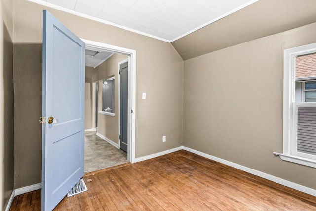 319 60th Ave W, Duluth, MN 55807 - spare room featuring hardwood / wood-style floors, baseboards, and vaulted ceiling