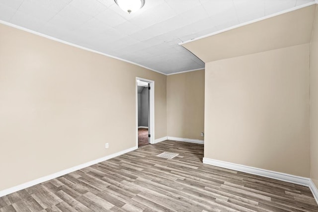 319 60th Ave W, Duluth, MN 55807 - empty room with wood finished floors, ornamental molding, and baseboards