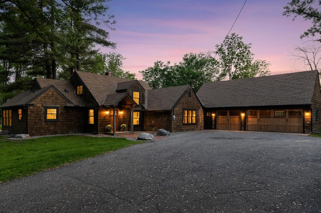 605 Stubbs Bay Rd, Orono, MN 55356 - shingle-style home featuring driveway, a garage, a chimney, and roof with shingles